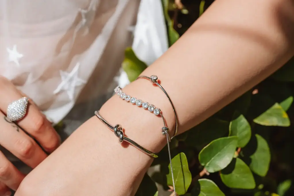 Silver bracelets on a wrist