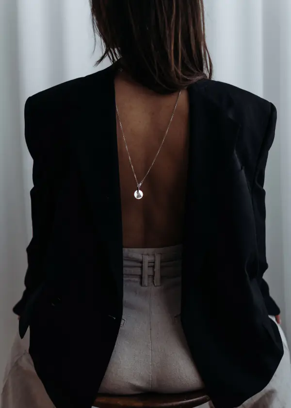 Pendant worn on the back