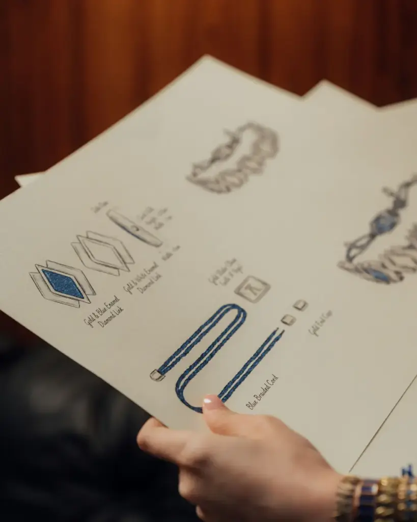 Designer reviewing jewelry sketches